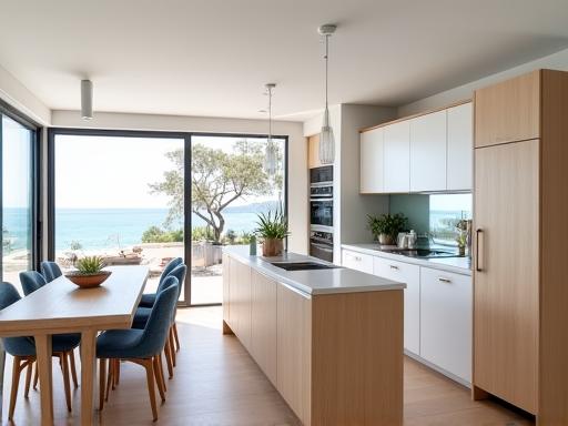 A modern coastal style kitchen with light wood accents and white cabinetry in Brighton.